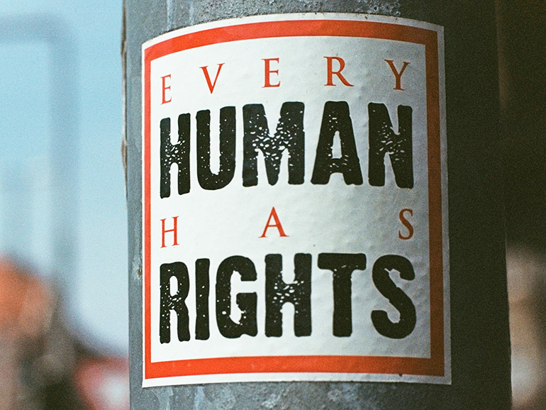"Every Human Has Rights" (Sticker on a lamp post)