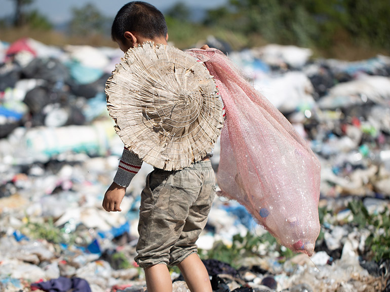 Child digging in the garbage heap