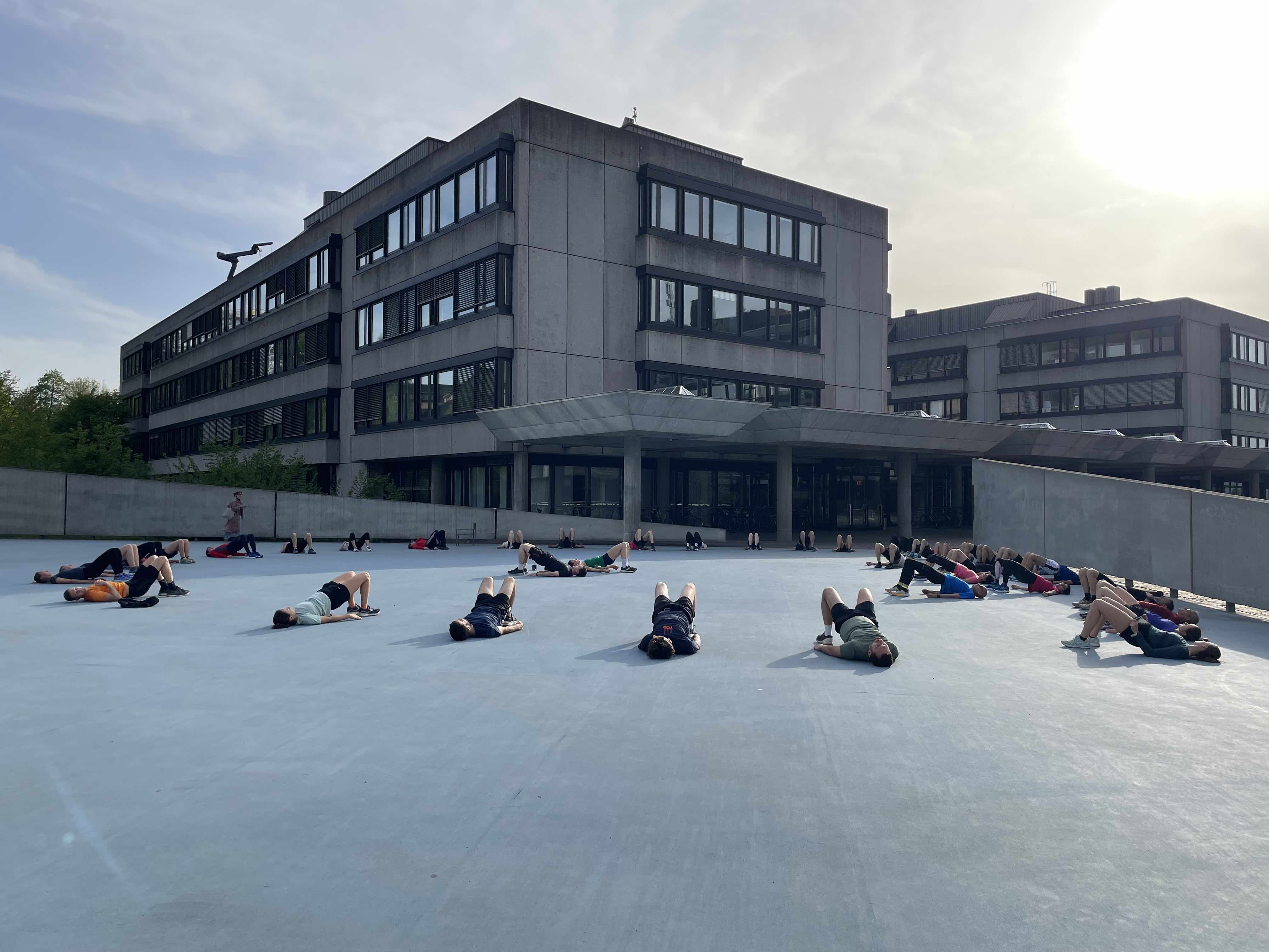 a photo of people doing exercises on Irchel Campus 
