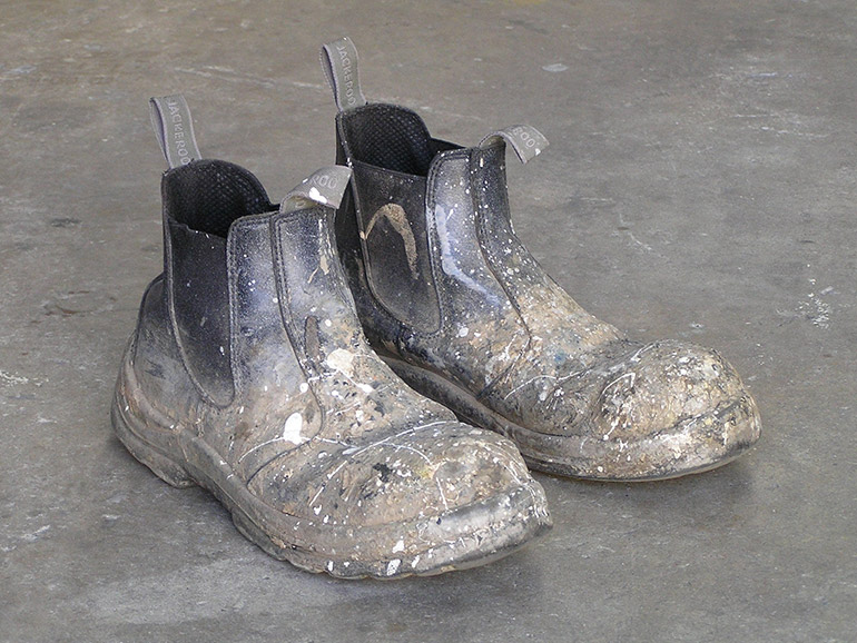 Heavily soiled work boots