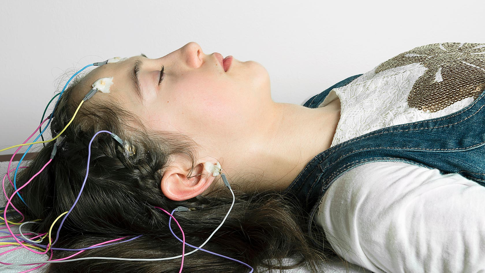 Sleeping woman with electrodes